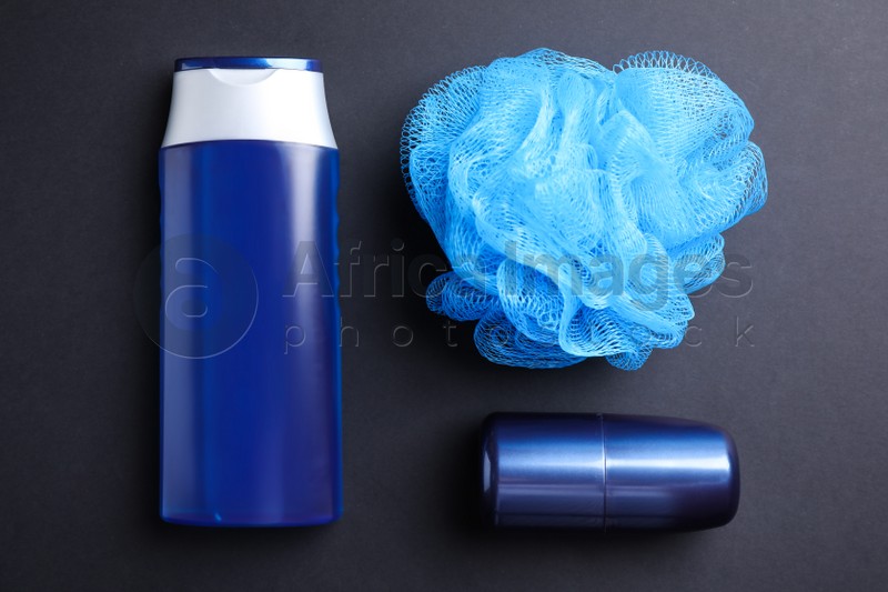 Photo of Shower gel, deodorant and bast wisp on black background, flat lay. Men's cosmetics