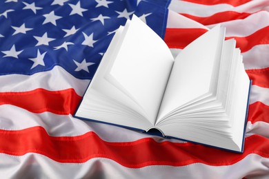 Photo of Open blank book on national American flag