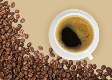 Image of Cup of tasty espresso and roasted coffee beans on beige background, flat lay