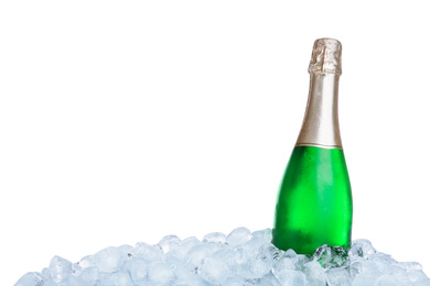 Ice cubes and bottle of champagne on white background