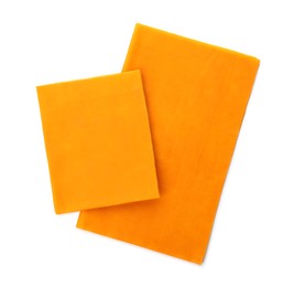 Orange reusable beeswax food wraps on white background, top view