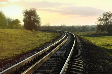 Photo of Railway line in countryside on sunny day. Train journey