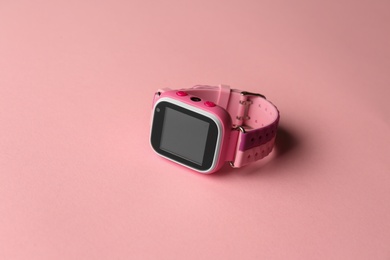 Modern trendy smart watch for kids on pink background