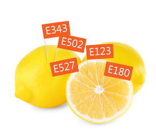 Fresh lemons with E numbers on white background. Harmful food additives 