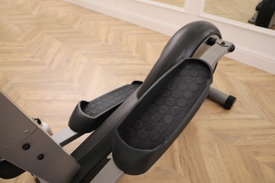 Modern elliptical machine cross trainer on floor indoors