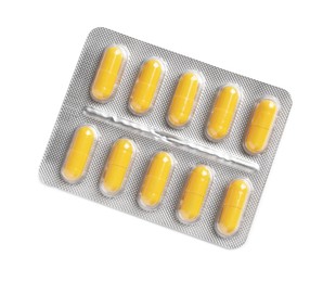 Blister with bright pills isolated on white, top view