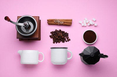 Photo of Flat lay composition with vintage manual grinder and geyser coffee maker on pink background