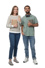 Happy students with books on white background