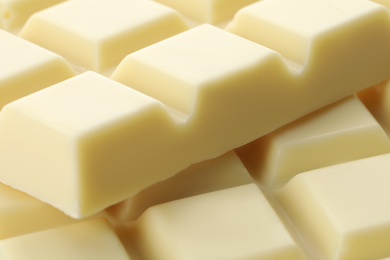 Delicious white chocolate as background, closeup view
