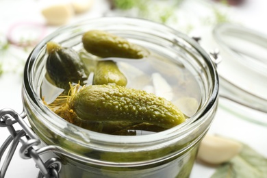 Glass jar of tasty pickled cucumbers, closeup