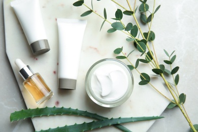 Flat lay composition with different body care products on table