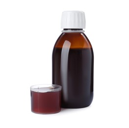 Bottle with measuring cup of syrup on white background. Cough and cold medicine