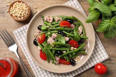 Tasty salad with green beans served on wooden table, flat lay