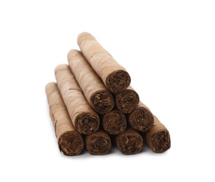 Cigars wrapped in tobacco leaves on white background