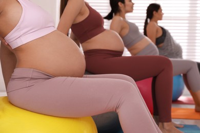 Group of pregnant women in gym, closeup. Preparation for child birth