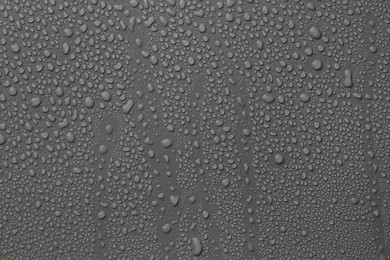 View of many water drops on grey background