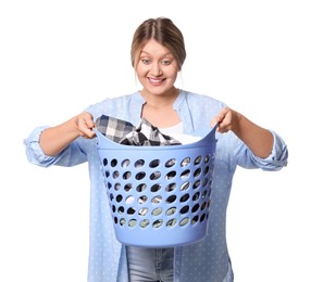 Photo of Emotional woman with basket full of laundry on white background