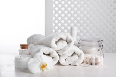 Photo of Spa composition with skin care products on white wooden table