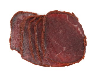 Delicious dry-cured beef basturma slices on white background, top view