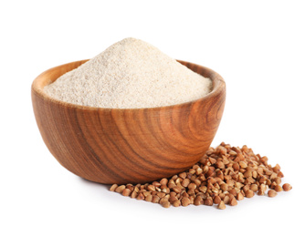 Buckwheat flour in wooden bowl and seeds on white background
