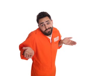 Prisoner in special jumpsuit perplexedly shrugging his shoulders on white background