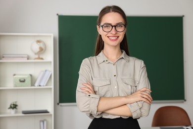 Photo of Portrait of beautiful young teacher in classroom