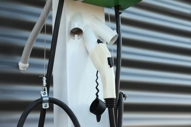 Electric vehicle charging station outdoors, closeup view