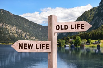 Alcohol addiction: what to choose - life with old bad habits or new good ones? Wooden signpost with different directions against beautiful mountain landscape