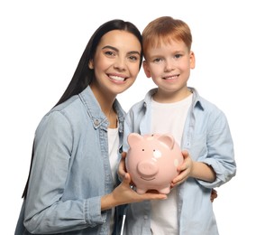 Mother and her son with ceramic piggy bank on white background