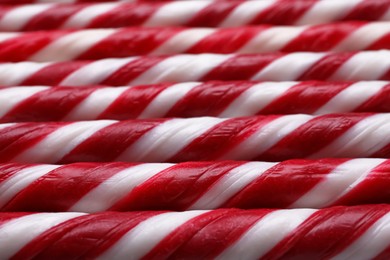 Many sweet Christmas candy canes as background, closeup