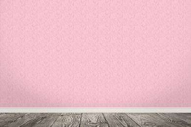 Pink wallpaper and wooden floor in room