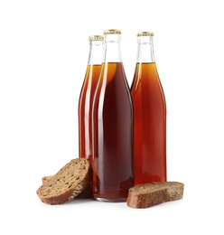 Photo of Bottles of delicious fresh kvass and bread isolated on white