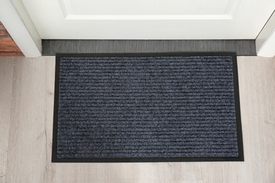 New clean mat near entrance door, top view