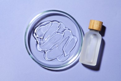 Petri dish with sample and bottle on lilac background, flat lay