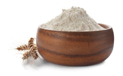 Photo of Flour in bowl and spikelets on white background