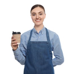 Beautiful young woman in clean denim apron with cup of coffee on white background