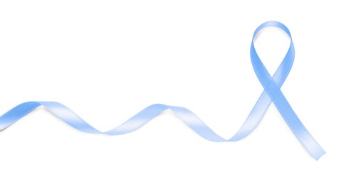 Photo of Light blue awareness ribbon on white background, top view