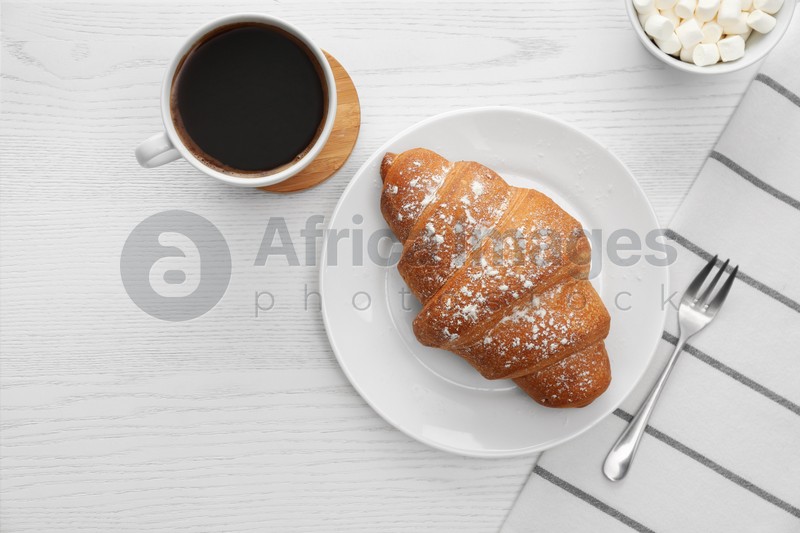 Delicious morning coffee and croissant on white wooden table, flat lay