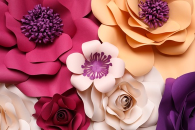 Photo of Different beautiful flowers made of paper as background, top view