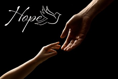 Image of Concept of hope. Man with child on black background, closeup of hands