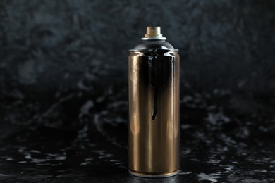 Used can of spray paint on black marble background. Space for text