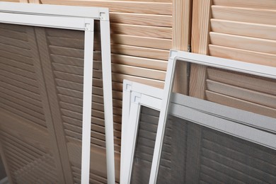 Set of window screens near wooden folding screen