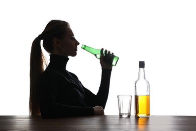 Alcohol addiction. Woman drinking beer on white background