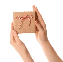 Woman holding parcel wrapped in kraft paper on white background, closeup