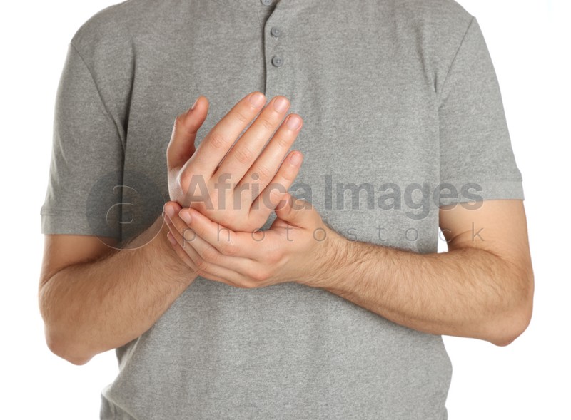 Man applying cream onto hand against white background, closeup