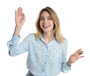 Photo of Cheerful young woman waving to say hello on white background