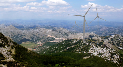 Alternative energy source. Wind turbines and mountains outdoors 