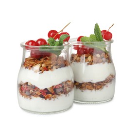Delicious yogurt parfait with fresh red currants and mint on white background