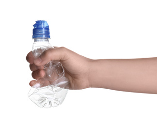 Woman holding crumpled bottle on white background, closeup. Plastic recycling