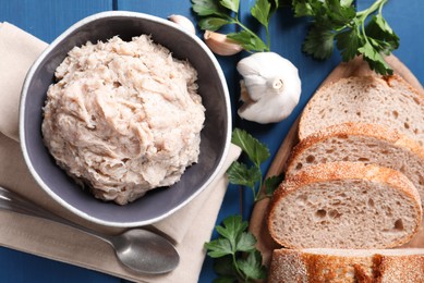 Photo of Delicious lard spread on blue wooden table, flat lay
